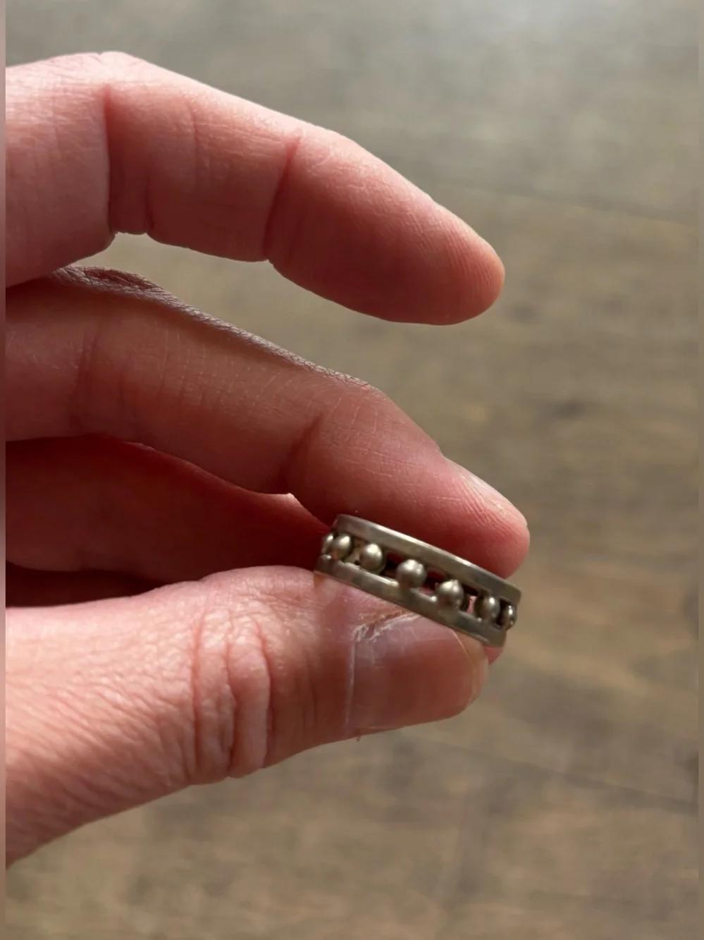 Women’s size 11.5 silver-toned metal ball bearing or studded channel band ring